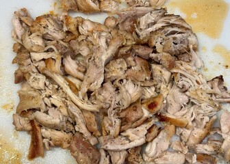 Cooked and shredded dark meat chicken ready to be used in a recipe