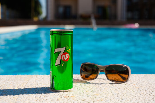 Anapa, Russia - July 18, 2023: cold can of 7up by the pool. Summer relaxation at the resort