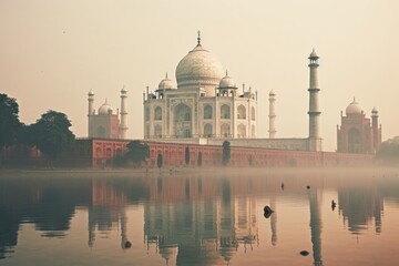 Fototapeta na wymiar A stunning, large white building majestically perched atop the calm waters of a picturesque lake, Majestic Taj Mahal on a foggy morning, AI Generated