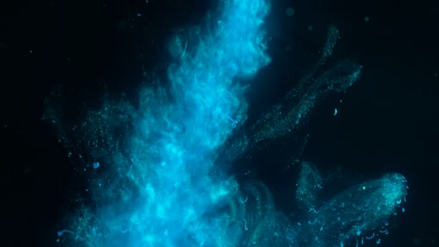 White luminous particles shimmer in blue liquid. Abstract digital particle wave and light abstract background. Floating particals in ocean. 