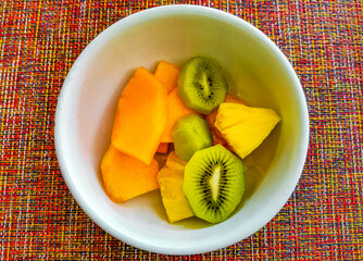 Fruit in a bowl for breakfast watermelon kiwi mango pineapple.