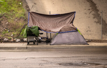 A homeless encampment under a bridge during a rain storm in San Diego County California