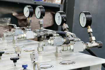 Fototapeta na wymiar Pressure switching valve of a high-pressure hydraulic oil station with pressure gauges.