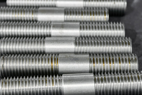 Double-sided studs with metric thread cut with a cutter on a lathe.