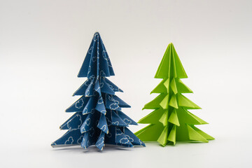 Two christmas trees made of blue and green paper