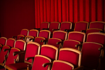 red empty seats for spectators in the theater or cinema