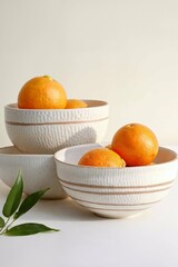 oranges in a bowl on the table