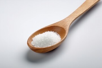 Fototapeta na wymiar Crystals of large sea salt in a wooden spoon