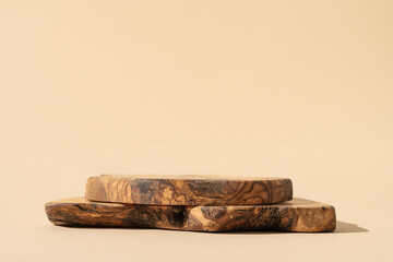 Rustic board stand. Background for products cosmetics, food or jewelry. Rustic wood pieces podium. Front view.	