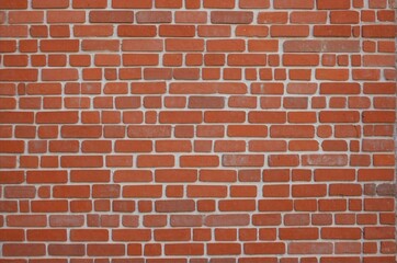 Close up photo of a red brick wall