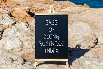 Ease of doing business index symbol. Concept words Ease of doing business index on beautiful blackboard. Beautiful stone sea background. Business, ease of doing business index concept. Copy space.