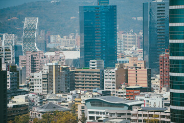 Kaohsiung's skyline, featuring towering skyscrapers and commercial buildings, showcases the vibrant urban life of this dynamic city.