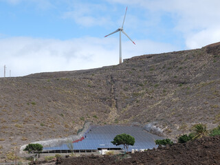 Solar panels and wind generator on dry slopes of Gran Canaria, Spain at the town of Agaete.