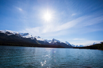 Summer landscape and people kayaking and fishing in Maligne lake, Jasper National Park, Canada