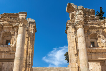 Pillars og ancient Roman Ruins of the Propylaeum in Jerash , Jordan.