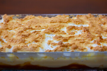 Traditional dessert from southern Brazil known as chico-balanceado, made with 3 layers: caramelized banana, creme anglaise and burnt meringues