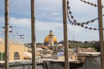 The Dome of the Rock and Bab al-Silsila Minaret, seen through barbed wire. Jewish and muslim...
