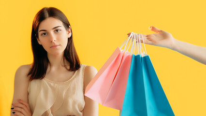 Shopaholic control. Reject offer. Dislike shopping. Woman customer refusing to receive shopping...
