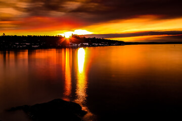 sunrise over calm water - Lysaker