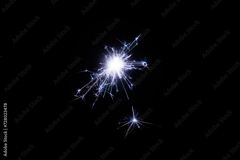 Poster Fireworks bengal Flicker on a dark background. Easy to add lens flare effects for overlay designs or screen blending mode to make high-quality images.