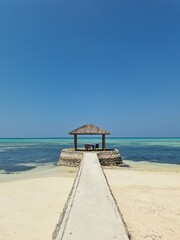 On vacation on the dream beach of the Maldives with the unique turquoise waters of the Indian Ocean.