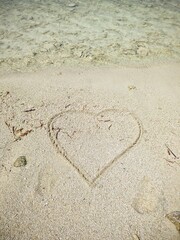 A romantic heart painted in the sand of the Maldives.
