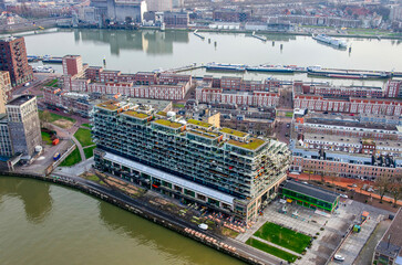 Rotterdam, The Netherlands, January 29, 2024: Katendrecht neighbourhood with residential building on top of old warehouse, located between two harbours