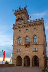 Fototapeta na wymiar Sunset at the Government Palace of the Republic of San Marino, also known as the Public Palace. It is home to the main institutional and administrative bodies of the small state.
