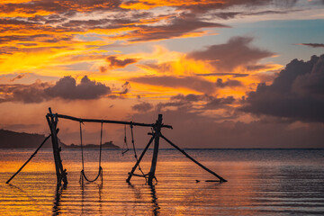 Guam Swing During a golden hour sunset - obrazy, fototapety, plakaty