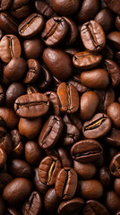 Fototapeta premium Background with a top view of oily coffee beans, rich contrast