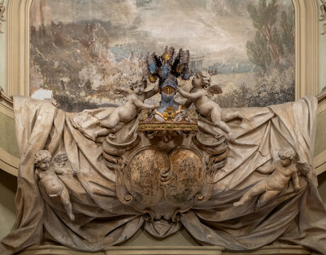 Rich, sculpted and painted, coat of arms with battle landscape fresco in background, 1735-40, Carlo Lodi and Atonio Rossi: painters; Carlo Nessi: sculptor. Malvezzi Campeggi Palace, Bologna, Italy.