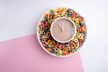 A plate with colorful cereals for breakfast. A complete diet for the day. Time to eat healthy. Food by the hour. Health concept, copy space