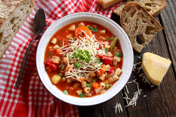 Minestrone soup with pasta and vegetables. Italian food. Selective focus.
