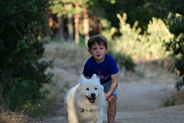 child playing with his dog