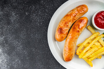 sausage french fries fast food fried meat and potatoes tasty fresh eating cooking meal food snack on the table copy space food background rustic top view