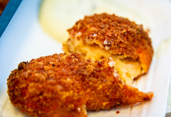 Closeup of half opened shrimp croquette, popular snack in Netherlands .