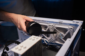 Cleaning the computer video card from dust with a brush and air. Computer fans in dust