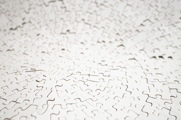 Plain white radial jigsaw puzzle defocused, abstract texture close up backdrop