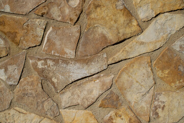 Fondo de textura de piedras marrones cortadas.