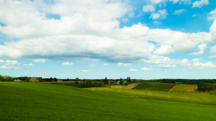 Green fields and hills in Wiezyca, Kashubian Region, Poland.