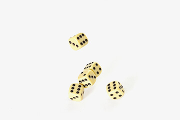 Conceptual photo of dice thrown on a white background.