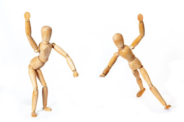 Wooden men in motion. The concept of people's relationships. Friends.Wooden doll Used to simulate human gestures.