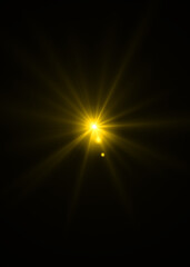 Obraz premium gold sunburst effect background,Lens flare light on black background or Lens flare glow light effect on black background.Easy to add overlay or screen filter over photos