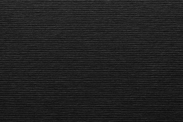 Black corrugated craft paper texture as background

