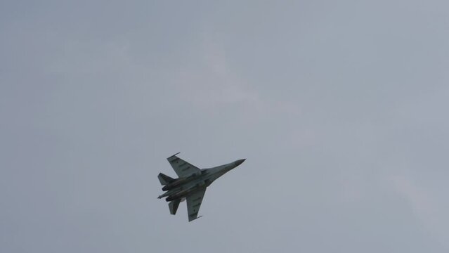 Military aircraft, combat fighters in the sky overhead. Parade of military equipment, air show
