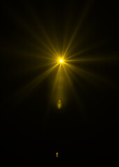 gold sunburst effect background,Lens flare light on black background or Lens flare glow light effect on black background.Easy to add overlay or screen filter over photos