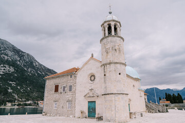 Fototapeta na wymiar Stone Church of Our Lady on the Rocks on the island of Gospa od Skrpjela. Montenegro