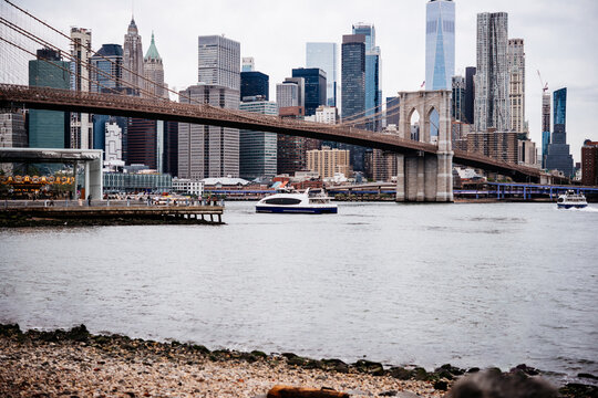 Fototapeta View of Brooklyn Bridge with Lower Manhattan skyline seen from the East River in New York City, United States.