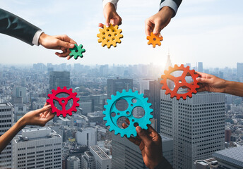 Business team connect pieces of gears like a teamwork and partners