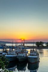 Fototapeta premium Three fishing vessels anchored at the port in Sozopol